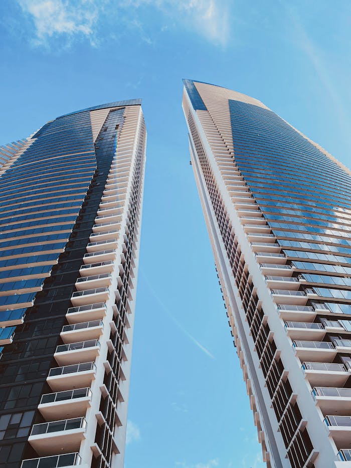 Low-angle shot of skyscrapers under a clear blue sky in Surfers Paradise, Australia.